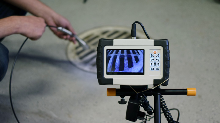 Man using sewer inspection camera